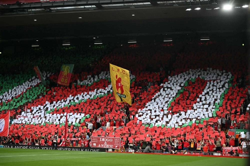 Liverpool fans hold up cards to create a mosaic as they pay tribute to late Portuguese forward Diogo Jota, on Friday at Anfield.  Liverpool fans hold up cards to create a mosaic as they pay tribute to late Portuguese forward Diogo Jota, on Friday at Anfield.