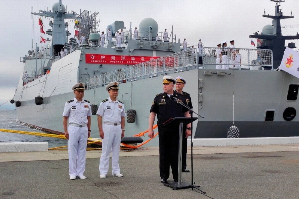 Russian and Chinese naval officers take part in a ceremony marking the start of joint naval drills in the Sea of Japan, following the arrival of Chinese military vessels in Vladivostok, Russia, on July 31. Russian and Chinese naval officers take part in a ceremony marking the start of joint naval drills in the Sea of Japan, following the arrival of Chinese military vessels in Vladivostok, Russia, on July 31.