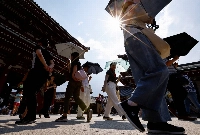 High temperatures are forecast to last for another month in Japan, according to the weather agency. | REUTERS