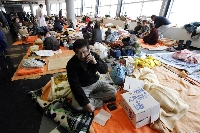 Evacuees at a shelter in Saitama Prefecture after the 2011 Great East Japan Earthquake in March 2011. With a tsunami expected to reach some areas within minutes after a Nankai Trough megaquake, the government is asking municipalities to designate areas where advance evacuation is necessary. | REUTERS