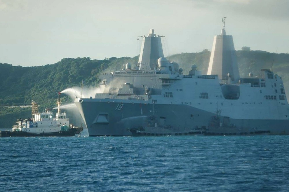 Smoke rises from the US Navy vessel USS New Orleans as water is sprayed to help put out the fire, near the White Beach Naval Facility in Okinawa on Wednesday. Smoke rises from the US Navy vessel USS New Orleans as water is sprayed to help put out the fire, near the White Beach Naval Facility in Okinawa on Wednesday.
