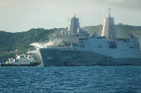 Smoke rises from the US Navy vessel USS New Orleans as water is sprayed to help put out the fire, near the White Beach Naval Facility in Okinawa on Wednesday. | JAPAN COAST GUARD / VIA AFP-JIJI