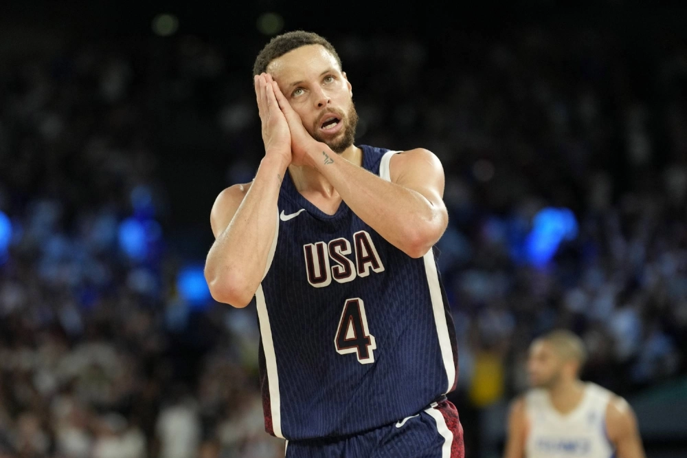 U.S. guard Stephen Curry celebrates after making a shot in the gold medal game against France during the Paris 2024 Olympic Summer Games. U.S. guard Stephen Curry celebrates after making a shot in the gold medal game against France during the Paris 2024 Olympic Summer Games.