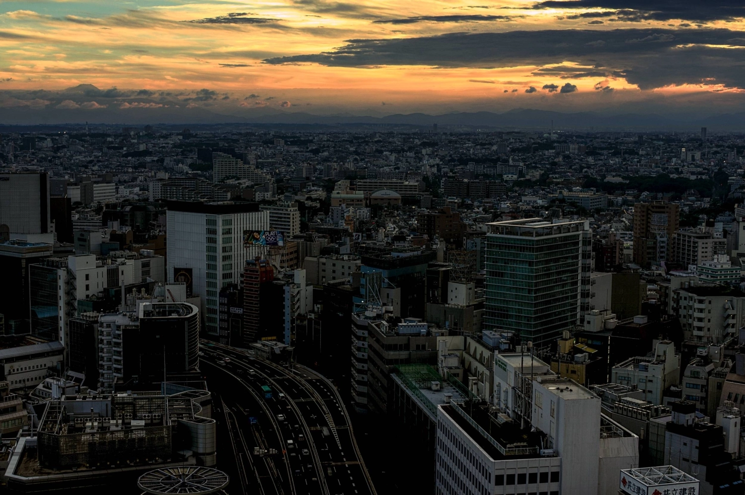 With Mount Fuji peeking over the clouds in the top left, Tokyo’s modern metropolis stretches as far as the eye can see. With Mount Fuji peeking over the clouds in the top left, Tokyo’s modern metropolis stretches as far as the eye can see.