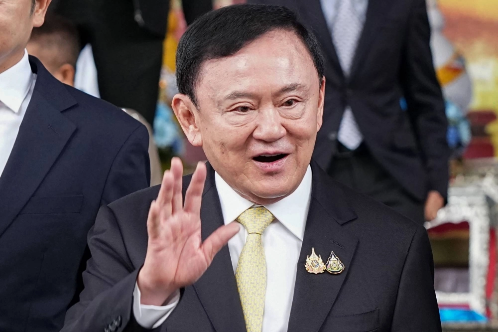 Former Thai Prime Minister Thaksin Shinawatra was cleared of royal defamation charges on Friday. Former Thai Prime Minister Thaksin Shinawatra was cleared of royal defamation charges on Friday.
