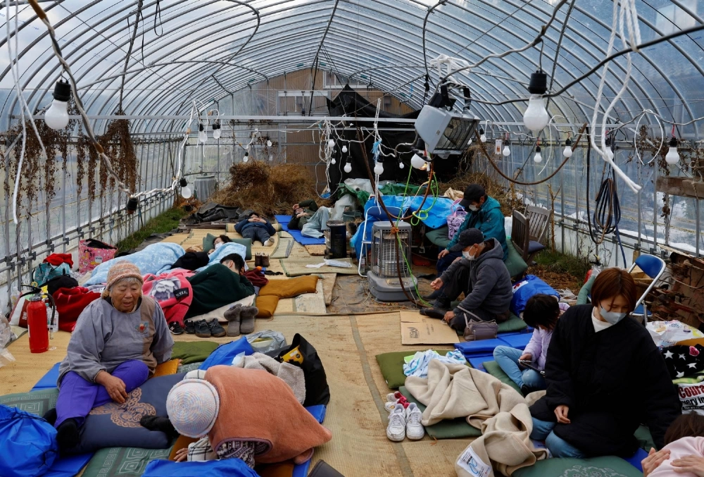 Evacuated people rest at a green house converted into an evacuation center in the aftermath of an earthquake in Wajima, Ishikawa Prefecture, on Jan. 2, 2024. Evacuated people rest at a green house converted into an evacuation center in the aftermath of an earthquake in Wajima, Ishikawa Prefecture, on Jan. 2, 2024.