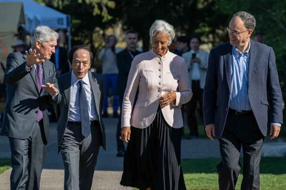 Bank of Japan Gov. Kazuo Ueda (second from left) walks with Fed Chair Jerome Powell (left), European Central Bank President Christine Lagarde (second from right) and Bank of England Gov. Andrew Bailey outside the Fed’s Jackson Hole Economic Policy Symposium on Friday. Bank of Japan Gov. Kazuo Ueda (second from left) walks with Fed Chair Jerome Powell (left), European Central Bank President Christine Lagarde (second from right) and Bank of England Gov. Andrew Bailey outside the Fed’s Jackson Hole Economic Policy Symposium on Friday.