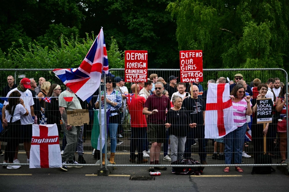 Anti-immigrant protestors demonstrate in Epping, northeast of London, on July 27. Anti-immigrant protestors demonstrate in Epping, northeast of London, on July 27.