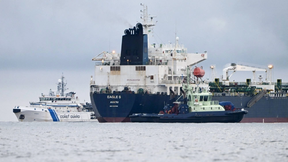 In this file photo taken on December 28, 2024 off Porkkalanniemi, Kirkkonummi, in the Gulf of Finland, Cook Islands-registered oil tanker Eagle S (center) is pictured next to Finnish border guard ship Uisko (left) and tugboat Ukko (right). In this file photo taken on December 28, 2024 off Porkkalanniemi, Kirkkonummi, in the Gulf of Finland, Cook Islands-registered oil tanker Eagle S (center) is pictured next to Finnish border guard ship Uisko (left) and tugboat Ukko (right).