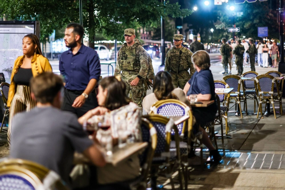 Members of the national guard patrol near diners in Washington on Aug. 23. Members of the national guard patrol near diners in Washington on Aug. 23.