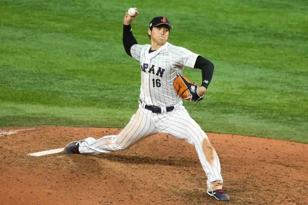 Japan's Shohei Ohtani delivers a pitch against the USA during the World Baseball Classic final at LoanDepot Park in Miami on March 21, 2023. Japan's Shohei Ohtani delivers a pitch against the USA during the World Baseball Classic final at LoanDepot Park in Miami on March 21, 2023.
