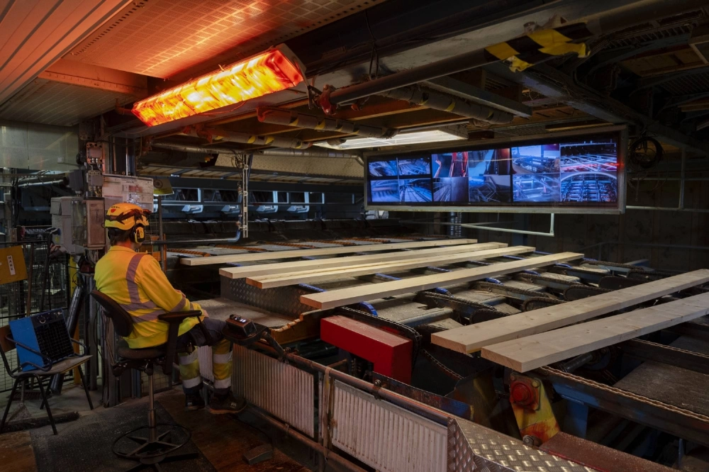A worker operates machinery at a sawmill in Sundsvall, Sweden A worker operates machinery at a sawmill in Sundsvall, Sweden