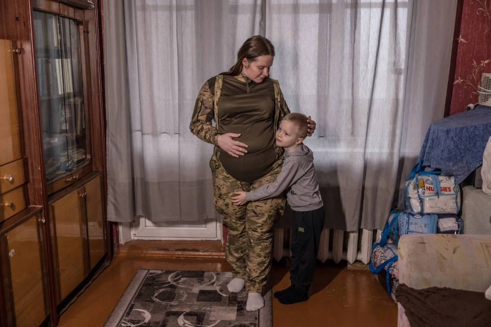 Nadia, a military radio operator who served until she was eight and a half months pregnant, with her son Pavlo, 6, at their home in Lubny, Ukraine, on Jan. 28. Nadia, a military radio operator who served until she was eight and a half months pregnant, with her son Pavlo, 6, at their home in Lubny, Ukraine, on Jan. 28.