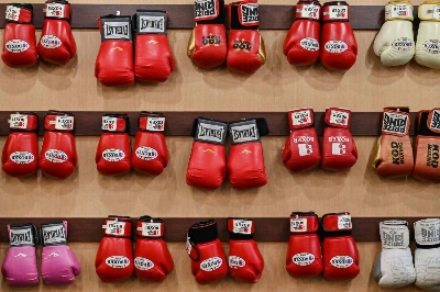 Boxing gloves on the wall of a gym in Tokyo ahead of a training session by American star Floyd Mayweather in September 2022. Intense sparring, drastic weight loss and lax regulation have created a dangerous environment in Japanese boxing, officials say, as the sport in the country reels from the deaths of two fighters. Boxing gloves on the wall of a gym in Tokyo ahead of a training session by American star Floyd Mayweather in September 2022. Intense sparring, drastic weight loss and lax regulation have created a dangerous environment in Japanese boxing, officials say, as the sport in the country reels from the deaths of two fighters.