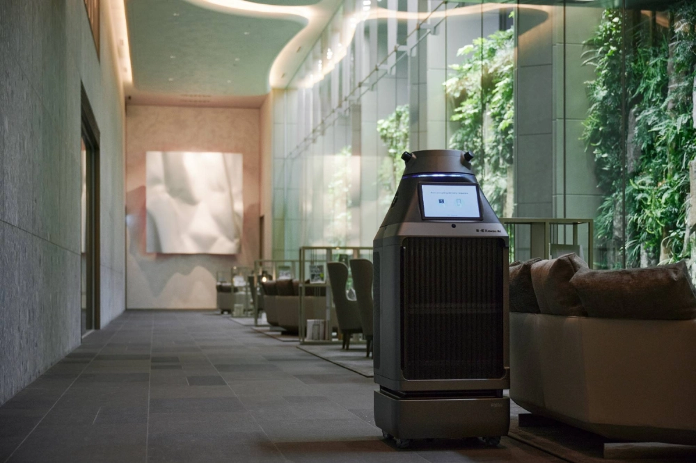A robot serves as a porter at Mita Garden Hills, a large apartment in Tokyo. A robot serves as a porter at Mita Garden Hills, a large apartment in Tokyo.
