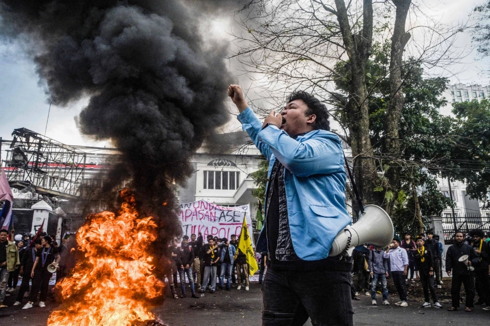 A demonstrator shouts slogans during a protest demanding police reform and the dissolution of the Indonesian parliament, in Bandung, West Java, on Monday. A demonstrator shouts slogans during a protest demanding police reform and the dissolution of the Indonesian parliament, in Bandung, West Java, on Monday.