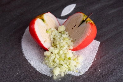 At Syn, chef Naoto Ohno's playfulness is evident in the "Apple," a replica fruit filled with applejack-flavored foie gras and served on a plate decorated with a familiar logo. At Syn, chef Naoto Ohno's playfulness is evident in the "Apple," a replica fruit filled with applejack-flavored foie gras and served on a plate decorated with a familiar logo.