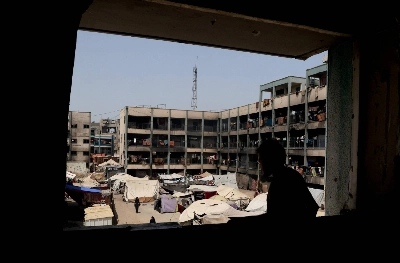 Palestinians displaced by the Israeli military offensive shelter in a UNRWA school, in Khan Younis, in the southern Gaza Strip, on Aug. 19. Palestinians displaced by the Israeli military offensive shelter in a UNRWA school, in Khan Younis, in the southern Gaza Strip, on Aug. 19.