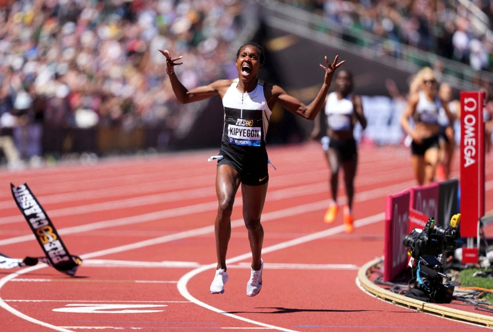 Faith Kipyegon celebrates after winning the women's 1,500 meters in world record time of 3 minutes, 48.68 seconds in Eugene, Oregon, on July 5. Faith Kipyegon celebrates after winning the women's 1,500 meters in world record time of 3 minutes, 48.68 seconds in Eugene, Oregon, on July 5.