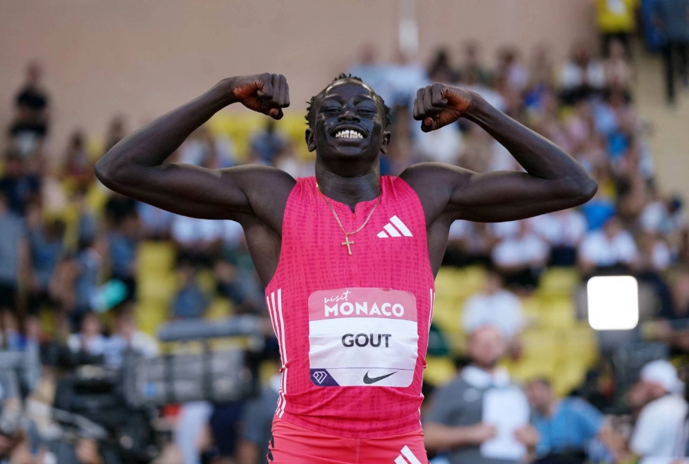 Australia's Gout Gout celebrates after winning the men's U-23 200-meter race at a Diamond League meet in Monaco on July 11.  Australia's Gout Gout celebrates after winning the men's U-23 200-meter race at a Diamond League meet in Monaco on July 11.
