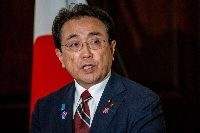 Japanese Economic Revitalization Minster Ryosei Akazawa speaks to members of the media at the Japanese Embassy in Washington on Thursday. | BLOOMBERG