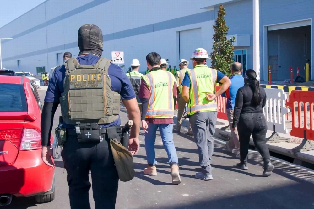 U.S. Homeland Security Investigations police officers execute a federal search warrant at a Hyundai Motor factory in Ellabell, Georgia, on Thursday.  U.S. Homeland Security Investigations police officers execute a federal search warrant at a Hyundai Motor factory in Ellabell, Georgia, on Thursday.