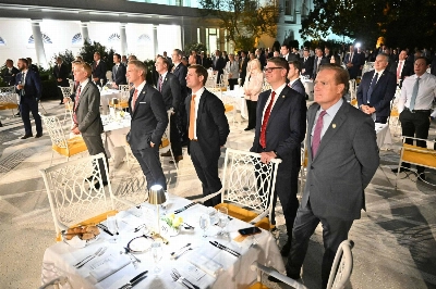 Attendees stand as U.S. President Donald Trump speaks during a dinner hosted in the newly renovated Rose Garden of the White House in Washington on Friday. Attendees stand as U.S. President Donald Trump speaks during a dinner hosted in the newly renovated Rose Garden of the White House in Washington on Friday.