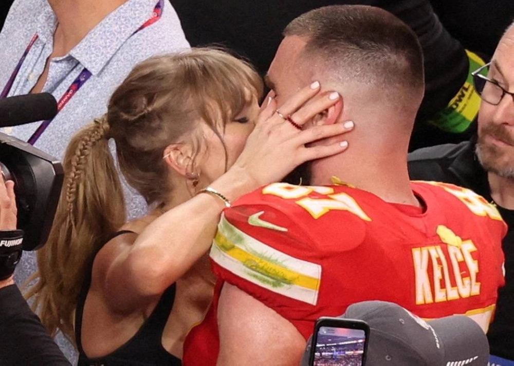 Kansas City Chiefs' Travis Kelce kisses partner — now finacee — Taylor Swift as they celebrate after his team won Super Bowl LVIII in 2024. Kansas City Chiefs' Travis Kelce kisses partner — now finacee — Taylor Swift as they celebrate after his team won Super Bowl LVIII in 2024.