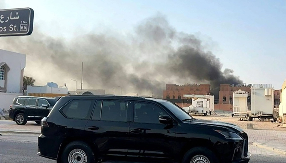 Smoke billows after explosions in Doha on Tuesday. Smoke billows after explosions in Doha on Tuesday.
