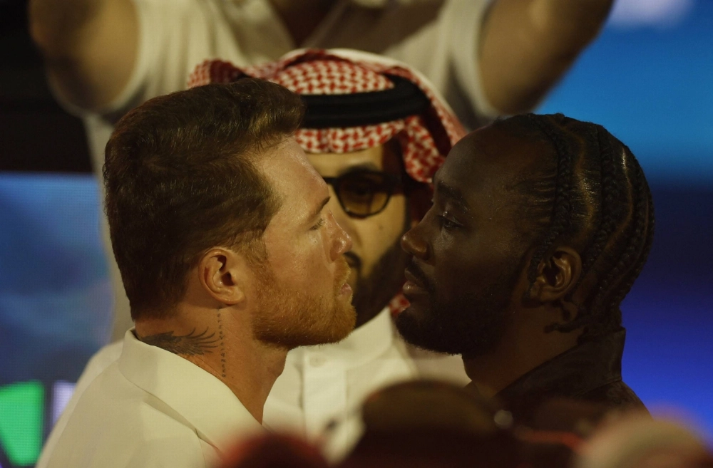 Canelo Alvarez (left) and Terence Crawford face off during a news conference in Riyadh in June.  Canelo Alvarez (left) and Terence Crawford face off during a news conference in Riyadh in June.