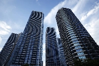 Residential buildings in the Harumi district of Tokyo. Condominium associations have started to invest in bonds to try and keep pace with inflation.  | BLOOMBERG