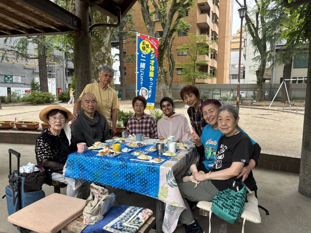 During the COVID-19 pandemic, Swastika Jajoo (fourth from right) began attending the daily radio calisthenics routine at Sendai’s Kitasanbancho Park and struck up unexpected friendships with a group of elderly residents. During the COVID-19 pandemic, Swastika Jajoo (fourth from right) began attending the daily radio calisthenics routine at Sendai’s Kitasanbancho Park and struck up unexpected friendships with a group of elderly residents.