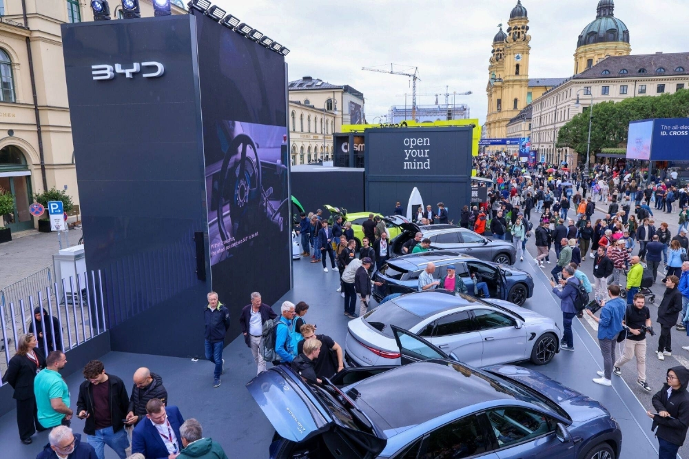 Attendees visit the BYD stand at an auto show in Munich, Germany, on Tuesday Attendees visit the BYD stand at an auto show in Munich, Germany, on Tuesday