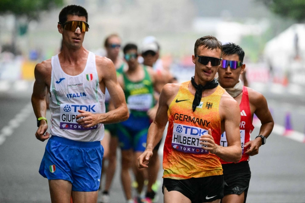 Germany's Jonathan Hilbert (right) competes during the men's 35K race walk at the world championships on Saturday. Germany's Jonathan Hilbert (right) competes during the men's 35K race walk at the world championships on Saturday.