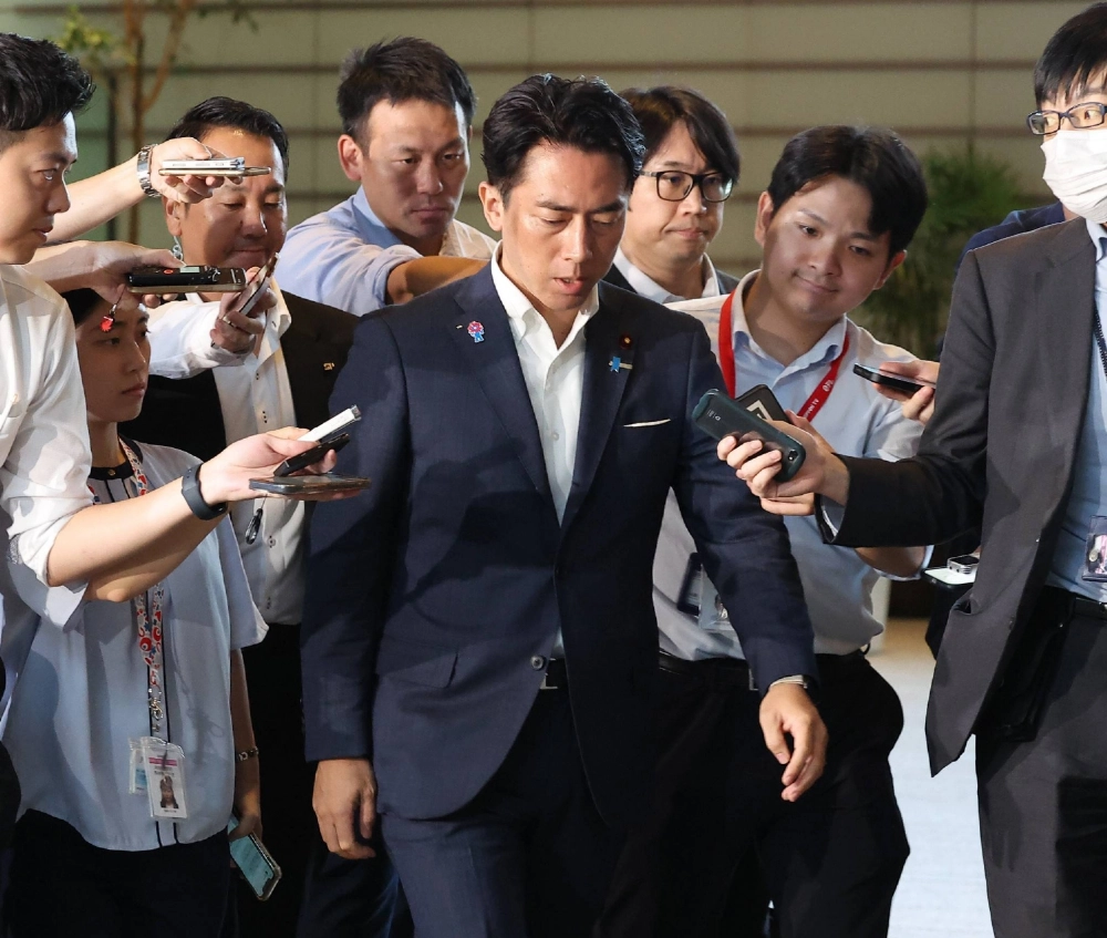 Agriculture minister Shinjiro Koizumi enters the Prime Minister's Office in Tokyo on Wednesday. Agriculture minister Shinjiro Koizumi enters the Prime Minister's Office in Tokyo on Wednesday.