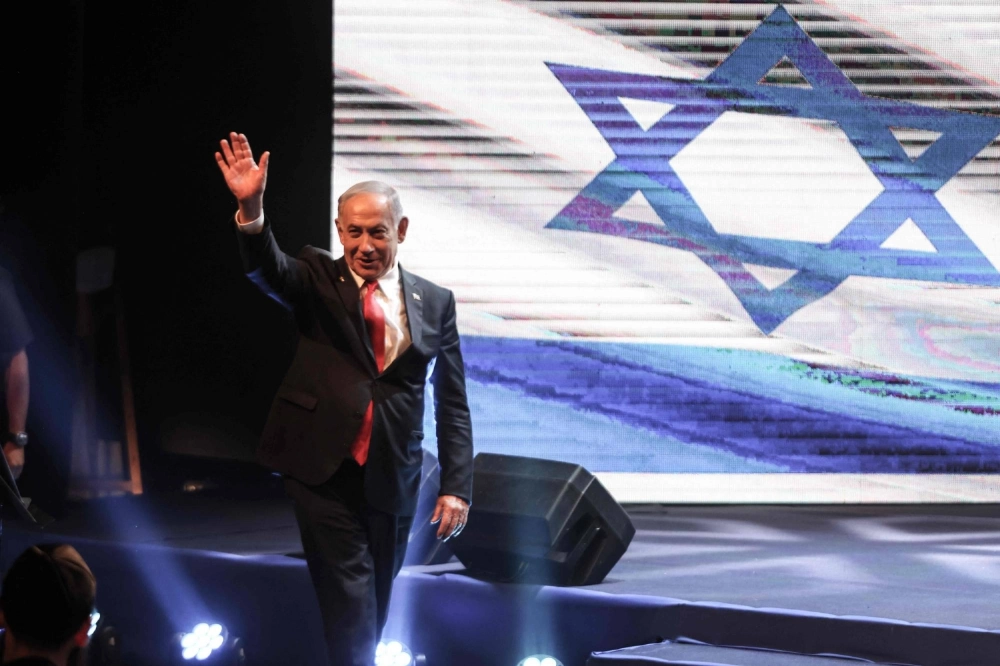 Israeli Prime Minister Benjamin Netanyahu waves as he arrives to attend a signing ceremony for a framework agreement, aiming to speed up development in the Israeli settlement of Maale Adumim, a settlement in the occupied-West Bank, on Thursday. Israeli Prime Minister Benjamin Netanyahu waves as he arrives to attend a signing ceremony for a framework agreement, aiming to speed up development in the Israeli settlement of Maale Adumim, a settlement in the occupied-West Bank, on Thursday.