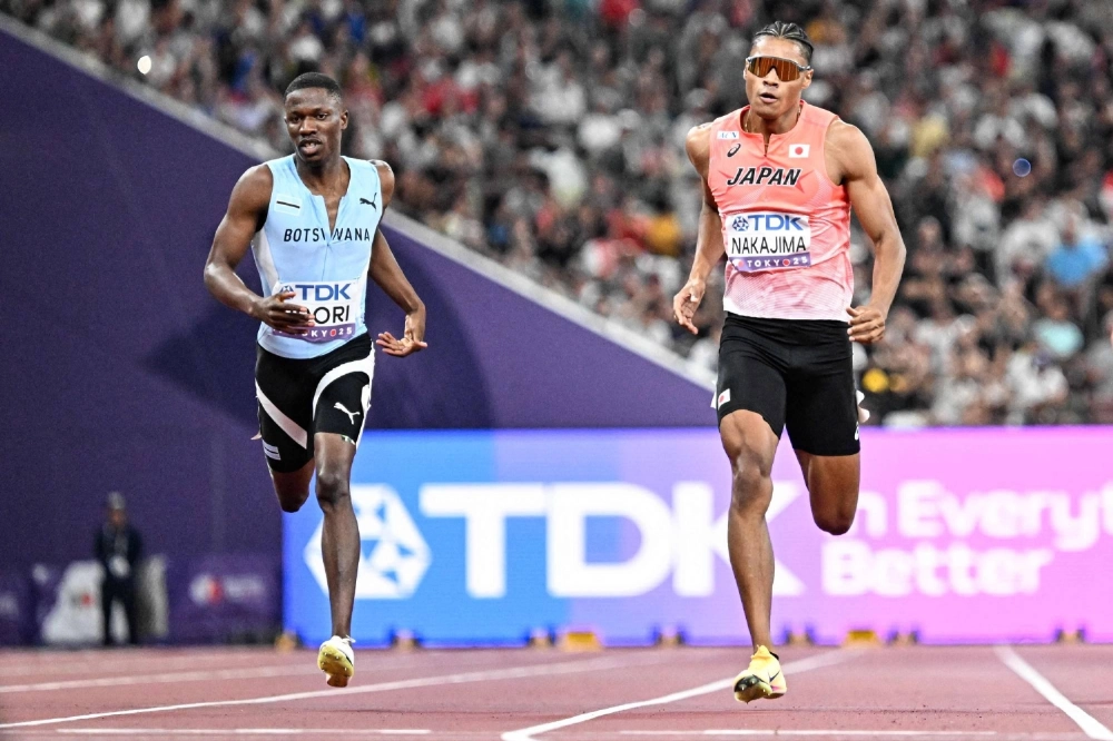 Yuki Joseph Nakajima (right) runs alongside Botswana's Bayapo Ndori during the men's 400-meter heats at the World Athletics Championships at Tokyo's National Stadium on Sunday. Yuki Joseph Nakajima (right) runs alongside Botswana's Bayapo Ndori during the men's 400-meter heats at the World Athletics Championships at Tokyo's National Stadium on Sunday.