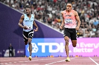 Yuki Joseph Nakajima (right) runs alongside Botswana's Bayapo Ndori during the men's 400-meter heats at the World Athletics Championships at Tokyo's National Stadium on Sunday. | AFP-JIJI