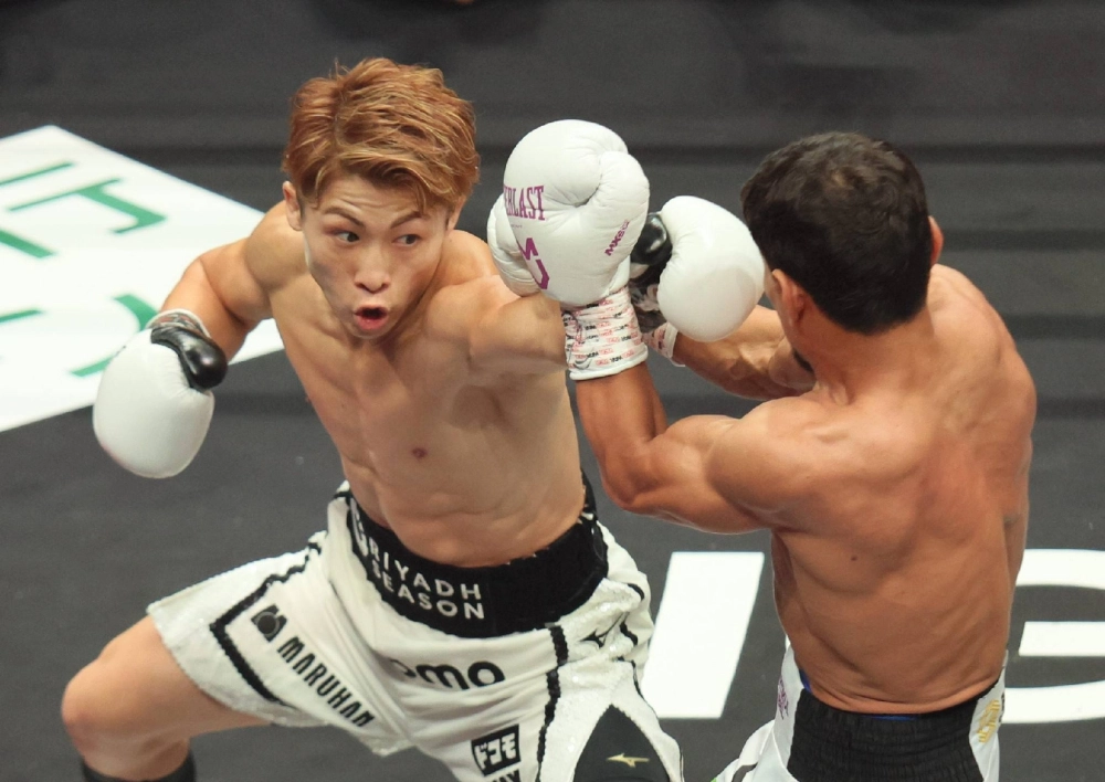 Naoya Inoue (left) battles Murodjon Akhmadaliev in Nagoya on Sunday.  Naoya Inoue (left) battles Murodjon Akhmadaliev in Nagoya on Sunday.
