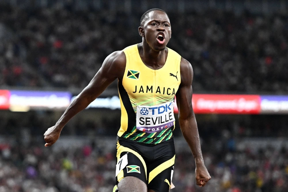 Jamaica's Oblique Seville celebrates winning the men's 100-meter final at the World Athletics Championships in Tokyo on Sunday. Jamaica's Oblique Seville celebrates winning the men's 100-meter final at the World Athletics Championships in Tokyo on Sunday.