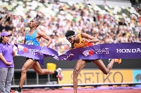 Germany's Amanal Petros (R) and Tanzania's Alphonce Felix Simbu cross the finish line in the men's marathon final during the World Athletics Championships in Tokyo on Monday. | AFP-JIJI