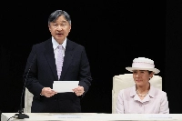 Emperor Naruhito delivers his address at the opening ceremony of the 40th National Cultural Festival and the 25th National Arts and Culture Festival for Persons with Disabilities, as Empress Masako looks on, in Sasebo, Nagasaki Prefecture, on Sunday. | JIJI