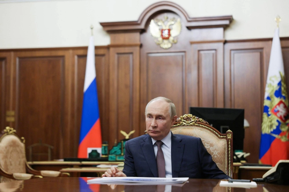 Russia's President Vladimir Putin attends a meeting with head of the Agency for Strategic Initiatives (ASI) autonomous non-profit organization at the Kremlin in Moscow on Thursday. Russia's President Vladimir Putin attends a meeting with head of the Agency for Strategic Initiatives (ASI) autonomous non-profit organization at the Kremlin in Moscow on Thursday.