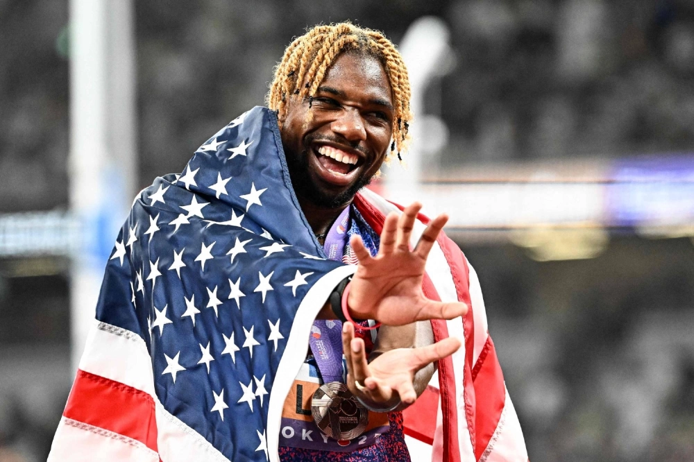 Noah Lyles does a Kamehameha pose from the the anime "Dragon Ball" after the men's 100-meter final at the World Athletics Championships. Noah Lyles does a Kamehameha pose from the the anime "Dragon Ball" after the men's 100-meter final at the World Athletics Championships.