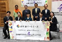 Five members of the Japan Foundation's Nihongo Partners program (front) gather at the Japanese Embassy in New Delhi on Monday. | JIJI