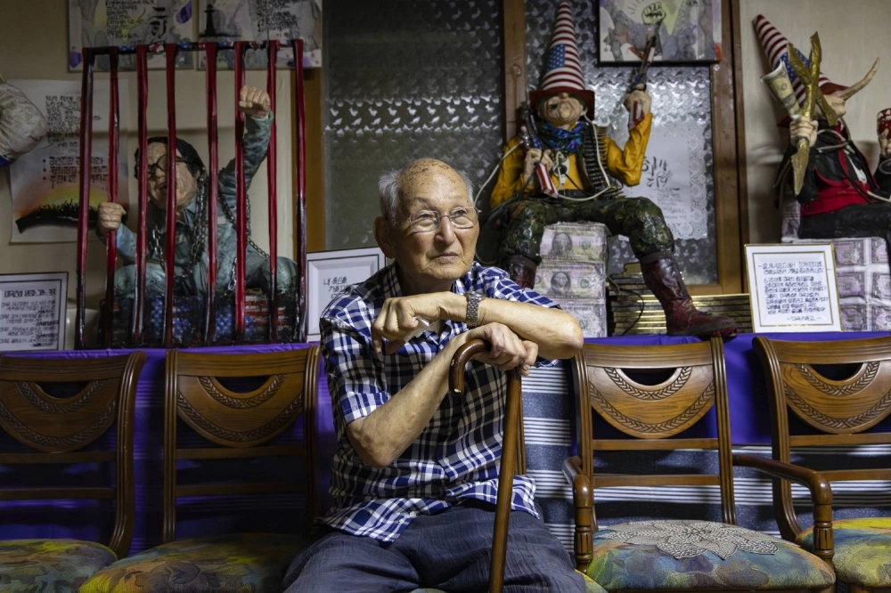 Ahn Hak-sop sits in front of his foster daughter’s paper-craft art-pieces in a small church in the Civilian Controlled Zone, near the border with North Korea, in Gimpo, South Korea.  Ahn Hak-sop sits in front of his foster daughter’s paper-craft art-pieces in a small church in the Civilian Controlled Zone, near the border with North Korea, in Gimpo, South Korea.