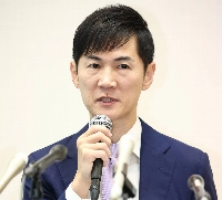 Shinji Ishimaru, leader of The Path to Rebirth party, holds a news conference in August in Tokyo. | Shinji Ishimaru, leader of The Path to Rebirth party, holds a news conference in August in Tokyo.