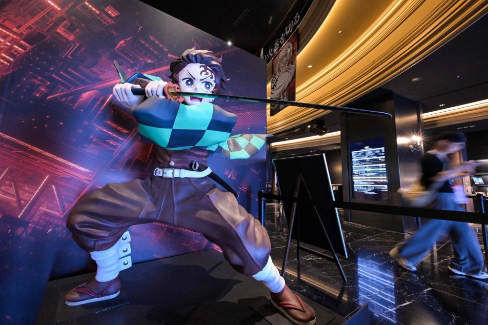 A statue of young swordsman Tanjiro Kamado, the main character in the "Demon Slayer" anime franchise, is on display at a cinema in Tokyo's Ikebukuro neighborhood. A statue of young swordsman Tanjiro Kamado, the main character in the "Demon Slayer" anime franchise, is on display at a cinema in Tokyo's Ikebukuro neighborhood.