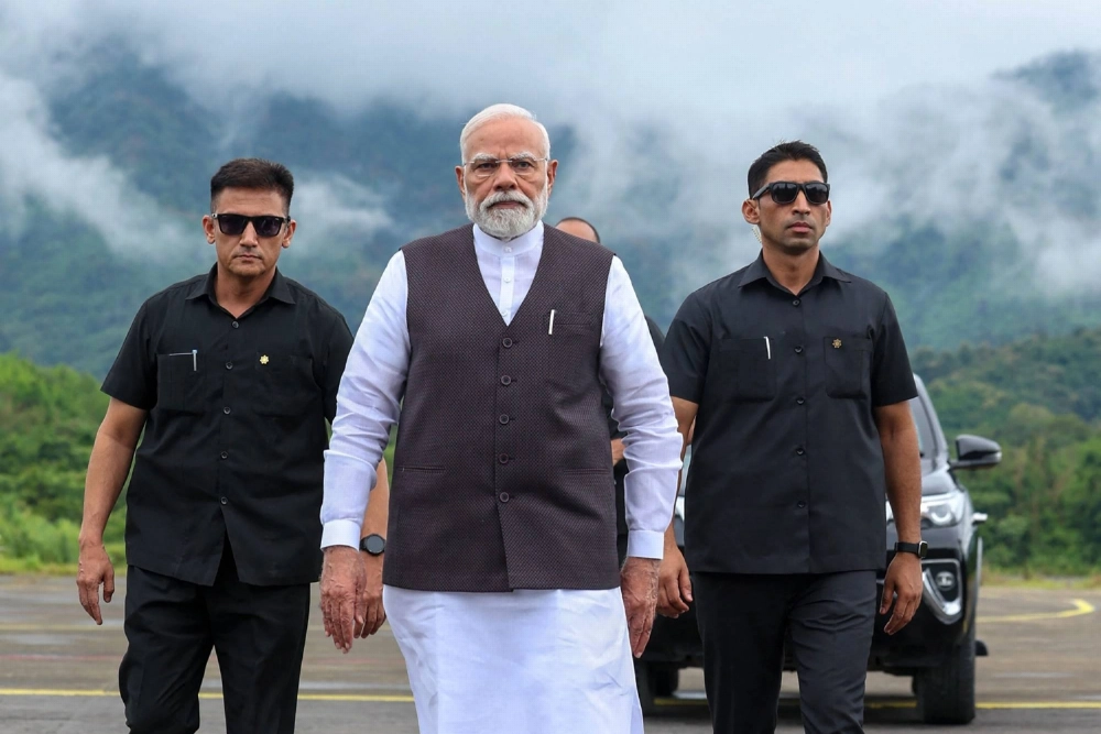 Indian Prime Minister Narendra Modi (center)  arrives at the airport in Imphal, in the northeastern state of Manipur, on Saturday. He made his first visit to troubled state since more than 250 people were killed in ethnic clashes there two years ago. Indian Prime Minister Narendra Modi (center)  arrives at the airport in Imphal, in the northeastern state of Manipur, on Saturday. He made his first visit to troubled state since more than 250 people were killed in ethnic clashes there two years ago.