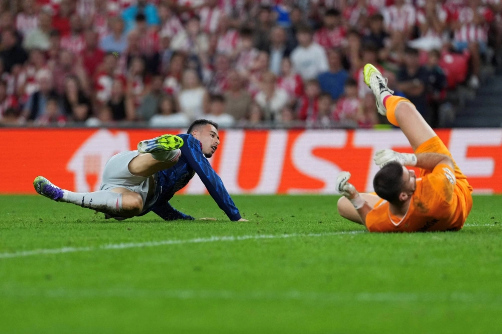 Arsenal's Gabriel Martinelli watches his effort enter the Athletic Club Bilbao net for his team's first goal in its Champions League opener on Tuesday in Bilbao, Spain.  Arsenal's Gabriel Martinelli watches his effort enter the Athletic Club Bilbao net for his team's first goal in its Champions League opener on Tuesday in Bilbao, Spain.